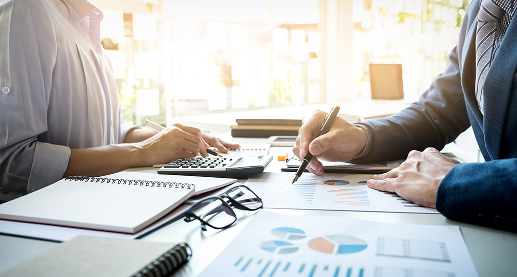 business man financial inspector and secretary making report, ca business man financial inspector and secretary making report, calculating or checking balance. Internal Revenue Service inspector checking document. Audit concept